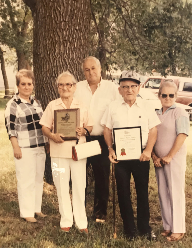 The Rossows (with children, from left to right: Bonnie, John, and Lois) in 1986 receving the Pioneer Award for having land in the family for 100 years.